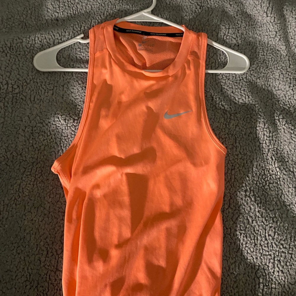 Peach color Nike running tank top.